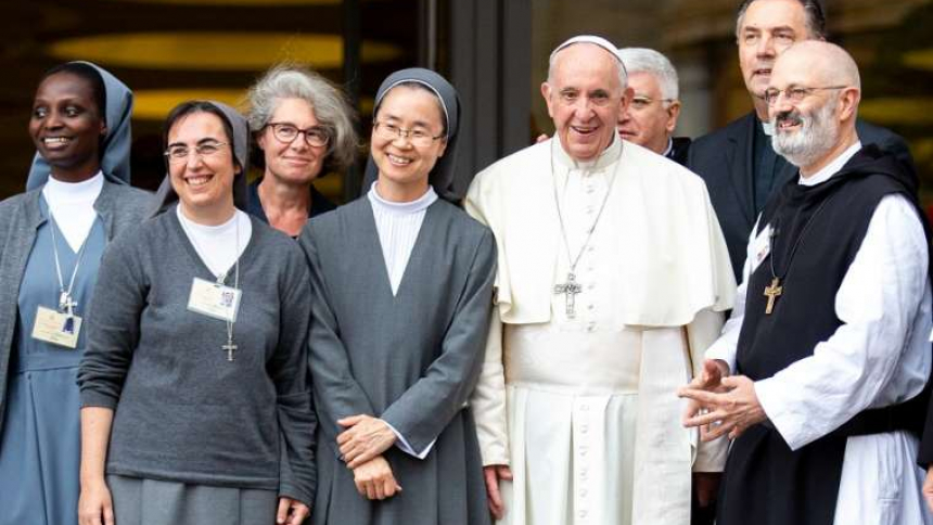 Sr. Nathalie Becquart (third from left) poses with Pope Francis and others during the youth synod in 2018.