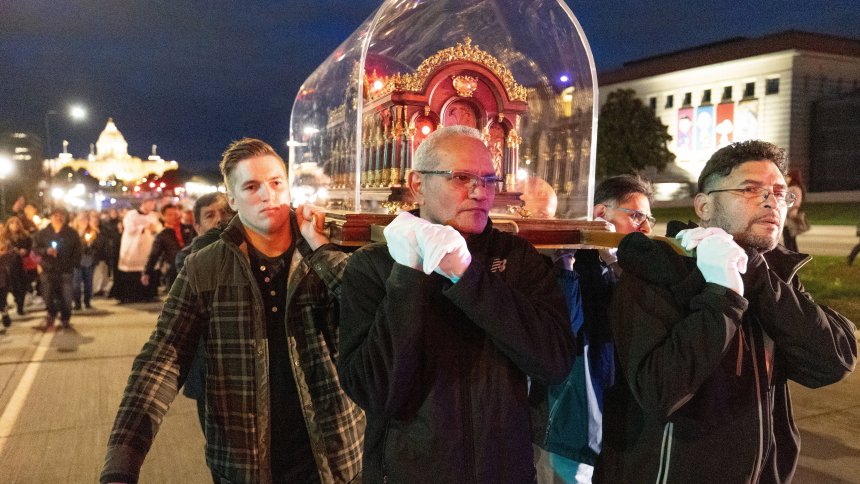 Men carry relics of St. Thérèse of Lisieux during the annual Candlelight Rosary Procession from the State Capitol to the Cathedral of St. Paul in St. Paul, Minn., Oct. 6, 2023. (OSV News photo/Dave Hrbacek, The Catholic Spirit)