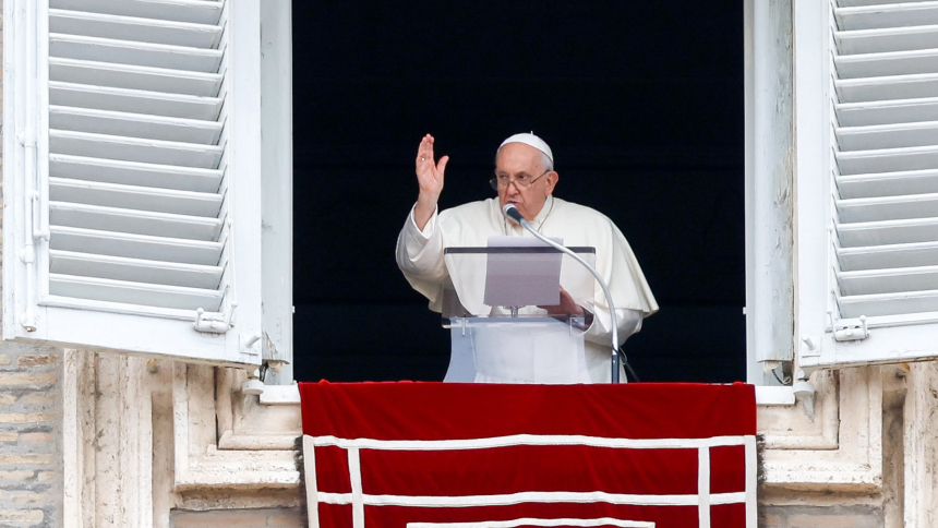 Pope Francis gives his blessing to an estimated 20,000 visitors gathered in St. Peter's Square at the Vatican after praying the Angelus Nov. 1, 2023, the feast of All Saints. (CNS photo/Lola Gomez)