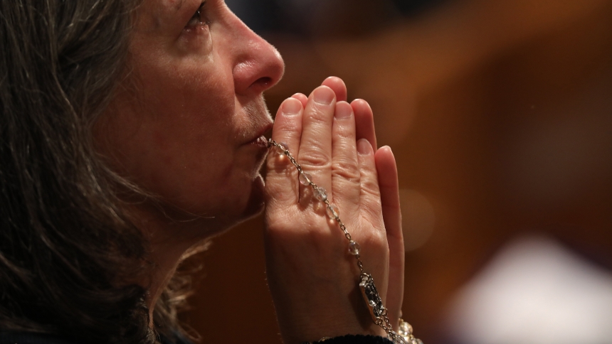 A woman becomes emotional as she prays with a rosary during Eucharistic adoration following the opening Mass of the National Prayer Vigil for Life Jan. 19, 2023, at the Basilica of the National Shrine of the Immaculate Conception in Washington. From Jan. 16-24, 2024, the U.S. bishops' Committee on Pro-Life Activities is inviting Catholics nationwide to pray "9 Days for Life." The annual Respect Life novena encompasses observance of the annual Day of Prayer for the Legal Protection of Unborn Children, which 