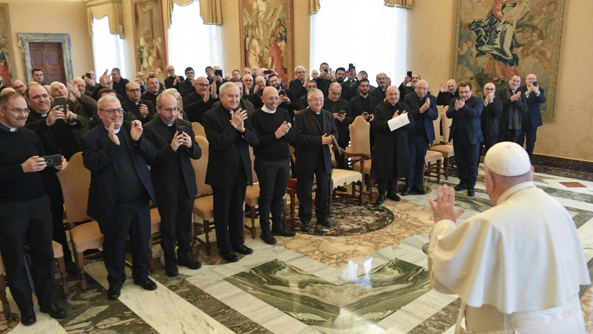 Pope Francis waves to diocesan priests who are members of the Missionary Priests of the Kingship of Christ Secular Institute at the end of an audience with the group in the Apostolic Palace at the Vatican Jan. 11, 2024. (CNS photo/Vatican Media)