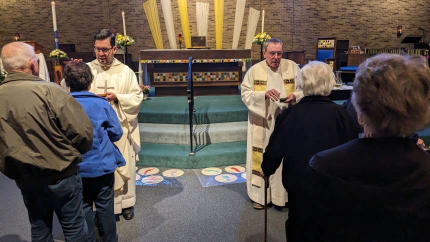 Father Leo Gajardo and Father Charles Niblick anoint and bless people at St. Maria Goretti in Dyer during an April 18 Mass of Anointing. More than 100 parishioners, caregivers, families and friends attended. (Lynda J. Hemmerling photo)
