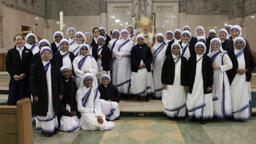 The Diocese of Gary, led by Bishop Robert J. McClory (center), welcomed more than 50 religious sisters from the Missionaries of Charity in Chicago, St. Louis, Peoria, Indianapolis and Detroit to St. Joseph the Worker in Gary to celebrate a Mass of Thanksgiving for 25 Years of Ministry in Northwest Indiana by the Missionaries of Charity. Currently, the Gary congregation includes (standing in front of the bishop) Sister Christa, Sister Dominique, Sister Celine John, and Sister Maria Jyoti. (Marlene A. Zloza p