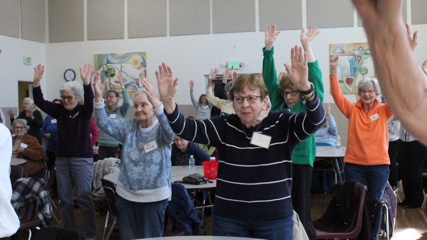 Pat Strange and Joni Zurad participate in chair yoga exercises led by vice president Sue Oczkowski (not pictured) during a Seniors of STM program at St. Thomas More in Munster on March 6. The group also learned about "Healthy Aging" from a registered dietitian. (Marlene A. Zloza photo)